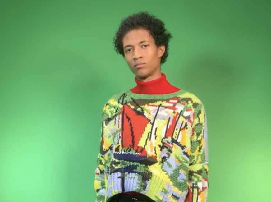 Male model stood infront of a green screen