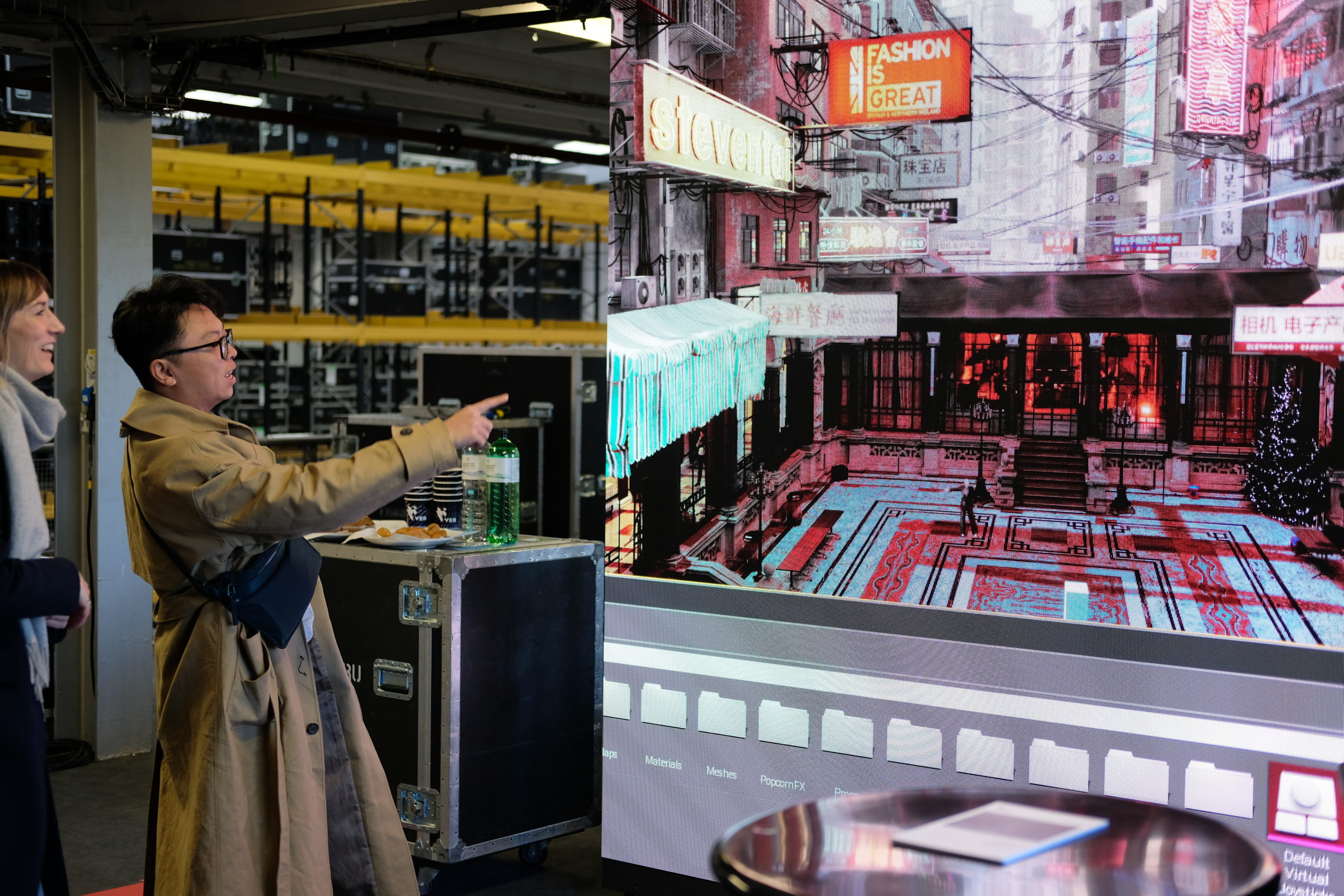 Man and woman looking at a screen showing digital augmentations