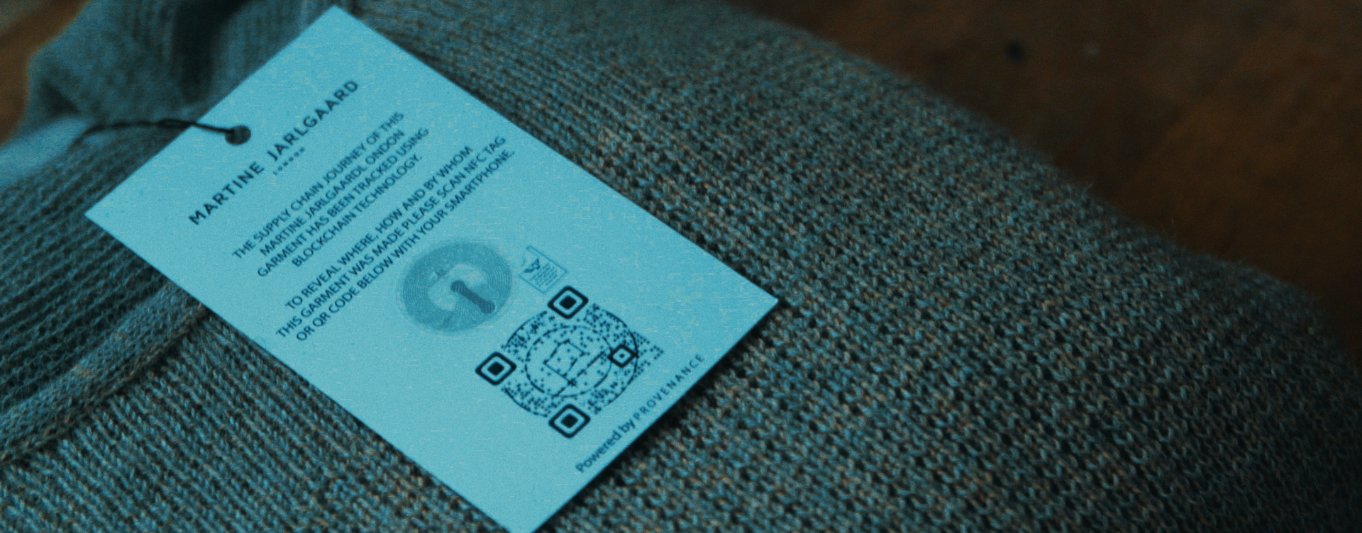 Clothing tag with QR code on Martine Jarlgaard London brand.